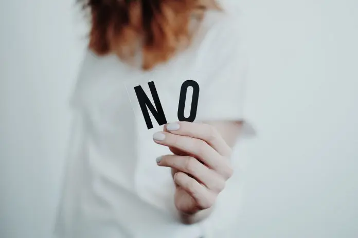 Woman holding letters N O