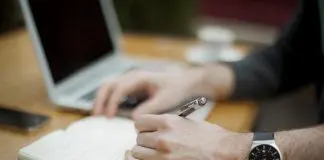 busy office worker taking notes