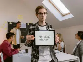 office holding up notepad
