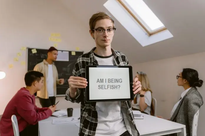HRHQ Selfish person office holding up notepad