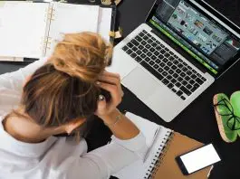 stressed lady with hands in head working