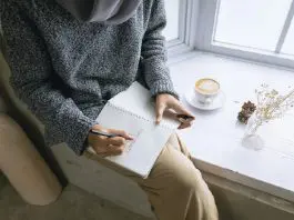 woman taking notes on health