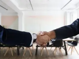 two people shaking hands