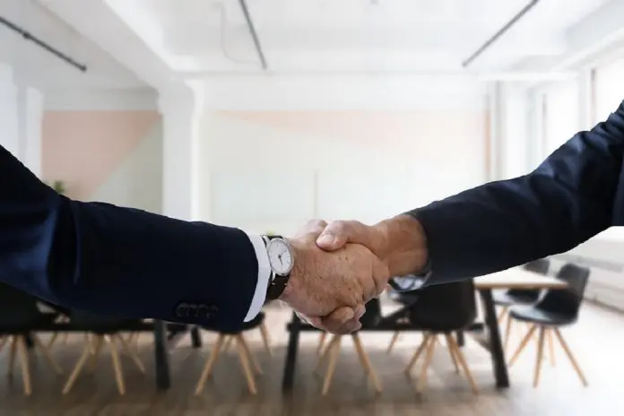 HRHQ Business critical hiring two people shaking hands