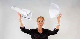 stressed woman throwing papers in the air