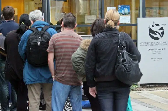 people lining up outside social welfare office