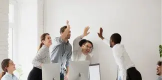 team celebrating in office