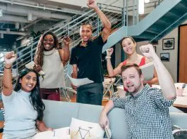 group of pumped up and motivated people in office
