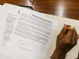 person reading employment agreement