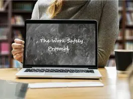 Woman holding laptop screen