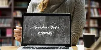 Woman holding laptop screen