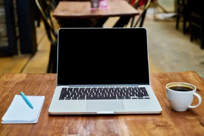 HRHQ Flexible work open laptop of hybrid worker