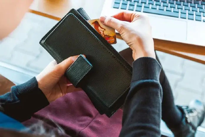 woman holding wallet