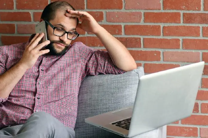 HRHQ Stressed worker stressed worker sitting beside laptop