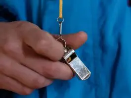 man holding whistle