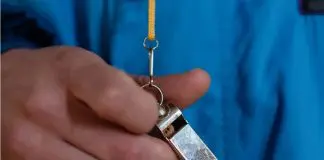 man holding whistle