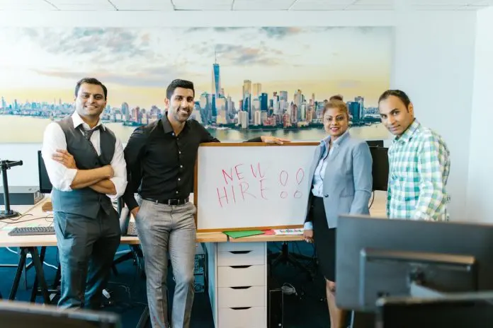 pexels-rodnae-productions-7581125 new employee welcome by small team