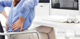 woman sitting with aching back