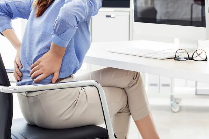 woman sitting with aching back