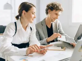 Intern with employee in office