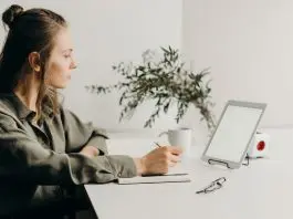 woman working from home sitting at laptop