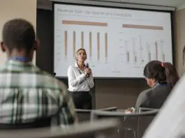 woman presenting with microphone in hand