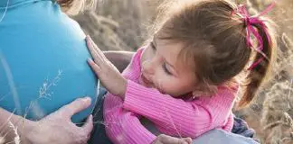 pregnant woman with young child