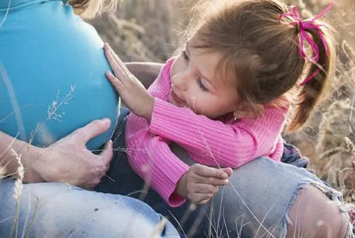 HRHQ Fertility treatment pregnant woman with young child