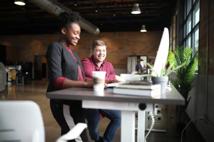 HRHQ office-desk workers colleagues in office having conversation