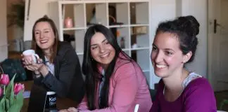 small group of women in office laughing
