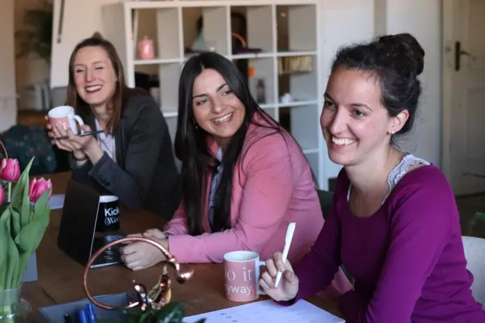 pexels-cowomen-2041390 small group of women in office laughing