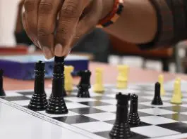 person making a chess move