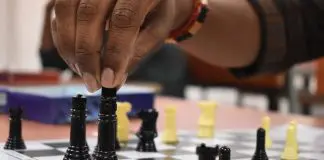 person making a chess move