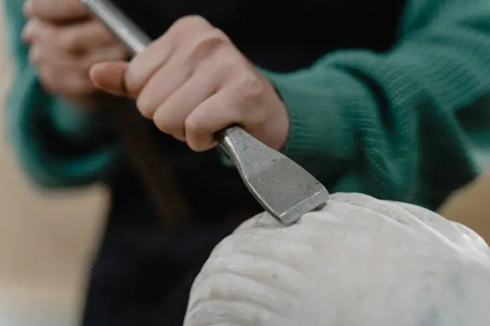 pexels-tima-miroshnichenko-6713855 person chiselling sculpture