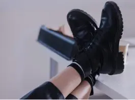 employee with feet on desk