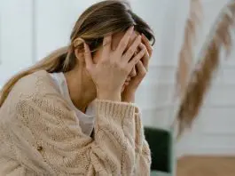 distressed woman with head in hands