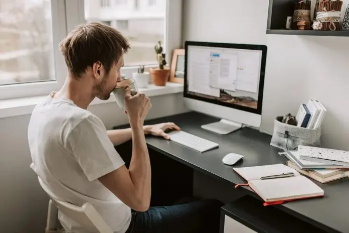 HRHQ Remote work inititives remote worker sitting at work station