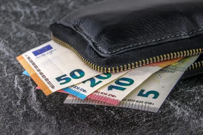HRHQ monthly living wage wallet open with money on display