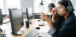 employee sitting at computer screen