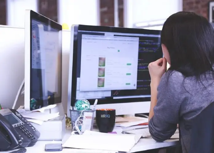 HRHQ News woman working in office on computer