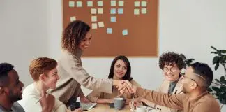 group of employees at productivity meeting