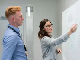teacher and student at white board