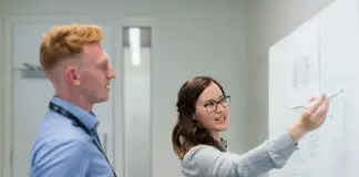 teacher and student at white board