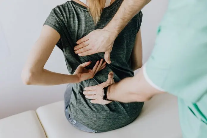 HRHQ Static Postures and pain patient being examined for back problems