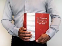 man holding The Protected Disclosures (Amendment) Bill 2022