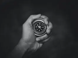 compass in hand in black and white image