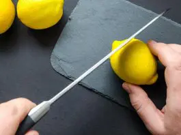 small part of lemon being cut off