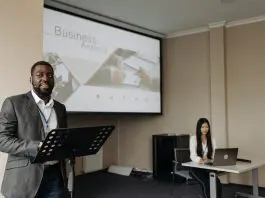 Man presenting slide of business analysis
