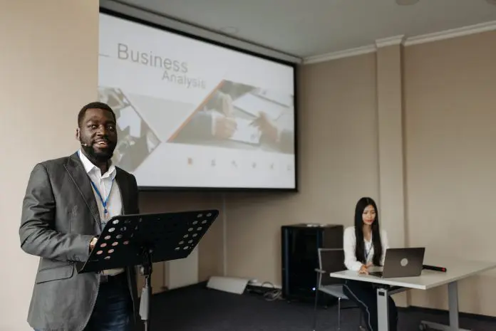 pexels-pavel-danilyuk-8761332 Man presenting slide of business analysis