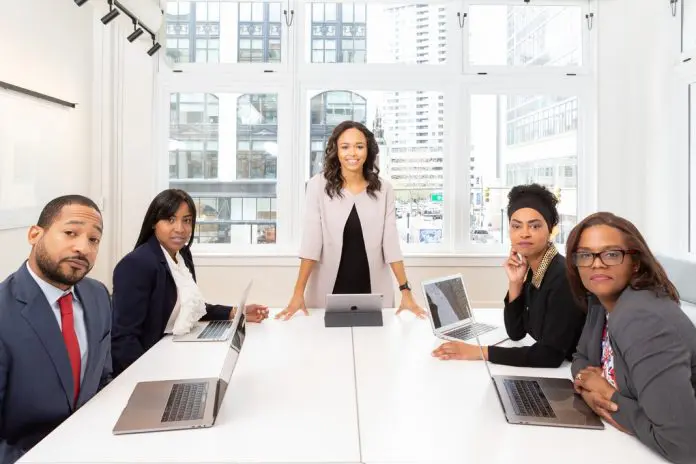 pexels-rebrand-cities-1367271 leader at conference table